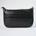 This croc sling bag is both stylish and practical, with ample space to carry all your essentials in one convenient place.