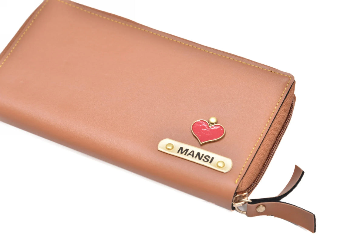 "Effortless Sophistication: Elevate your look with the understated sophistication of our zip around clutch, a statement accessory in its simplicity."